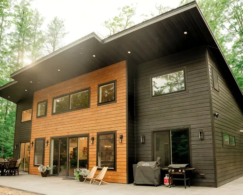 Modern mountain- inspired monoslope home located in the beautiful Northwoods Hotels in Round Lake