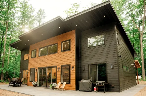 Modern mountain- inspired monoslope home located in the beautiful Northwoods