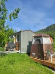 Tiny House with Stunning Mountain Views, 5 Min Forested Trail Walk to Arrow Lake - 2-Star
