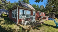 Charming 4-bedroom cottage ON Tawas Lake Pet, kid-friendly. Great Bird watching!