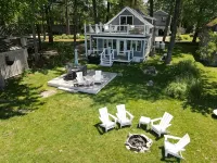 Relax in Raymond's lakefront 2-bedroom vacation home, just steps to Sebago Lake