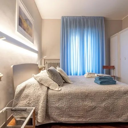Large and bright penthouse in the heart of the city of Parma near the station