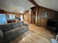 Charming 2-bedroom cabin sits on 2.5 acres on Hubbard Lake.