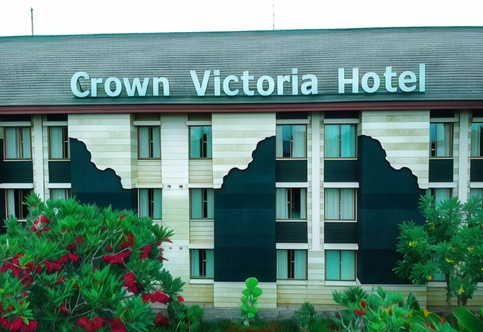 "a large building with the name "" crown victoria hotel "" prominently displayed on the side of the building" at Crown Victoria Hotel Tulungagung