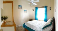 PalmVille - Charming 2-bedroom house with AC, WiFi