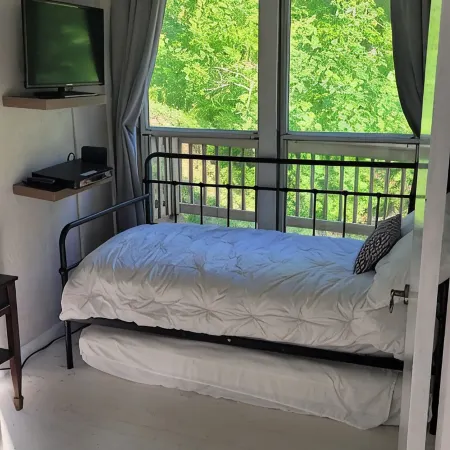 Cozy cool cabin in the mountains with a view Close to Downtown with a hot tub
