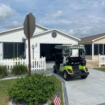 Refurbished villa with golf cart, great location, corner lot