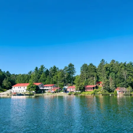 Rustic Log Cabin #8 on Crow Lake at Bull Moose Lodge. Family and pet friendly