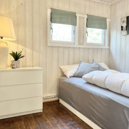 Cozy vacation home in southern Norway (Tromøy, Arendal) with a boat and a pier.