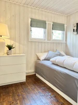 Cozy vacation home in southern Norway (Tromøy, Arendal) with a boat and a pier.