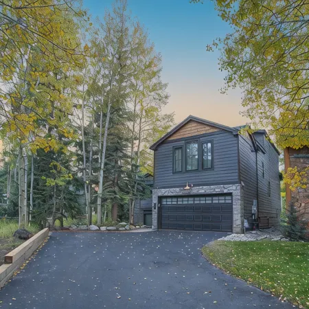 Dreamy home on river, mountain views, steps from town.