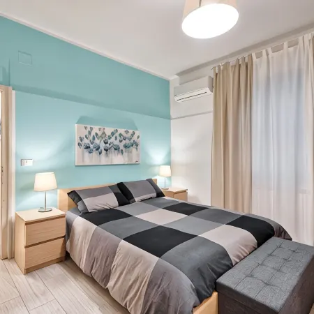 Large apartment between beach and city- With parking and private beach.