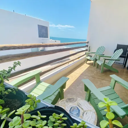 Apartment with mountain view, private balcony and access to beach front terrace.