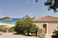 Baia Chia Laguna Resort, Curio Collection by Hilton