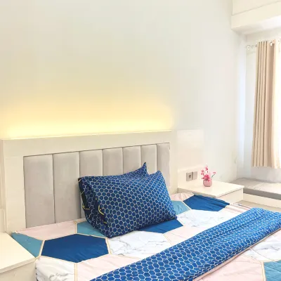 Studio Room with Netflix at Apartemen Grand Kamala Lagoon by Apartemenku