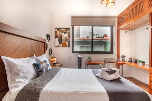 Deluxe Room in Condesa + Rooftop & Coworking - Epsilon by Nomadier - บังกะโล