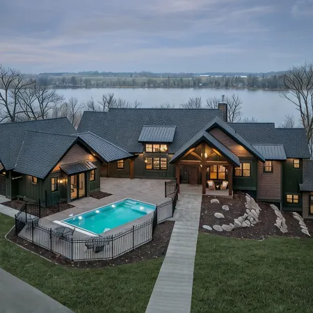 Private lakeside retreat with pool, hot tub, and sauna