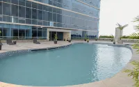 Combined Grey Toned 2BR Apartment at The City Square Surabaya By Travelio