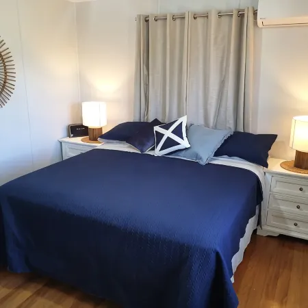 Indoor/outdoor pet-friendly beach house next to world-class beach and river.