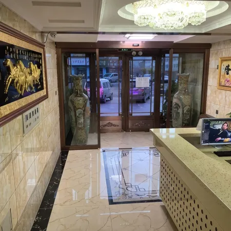 Helong Xinsi Road Business Hotel