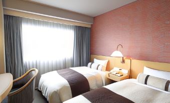 a hotel room with two beds , a window , and a nightstand , giving an impression of a well - arranged stay at Numazu River Side Hotel