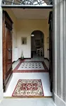 Historic house with garden in front of the Grotta Giusti Thermal pool near Lucca