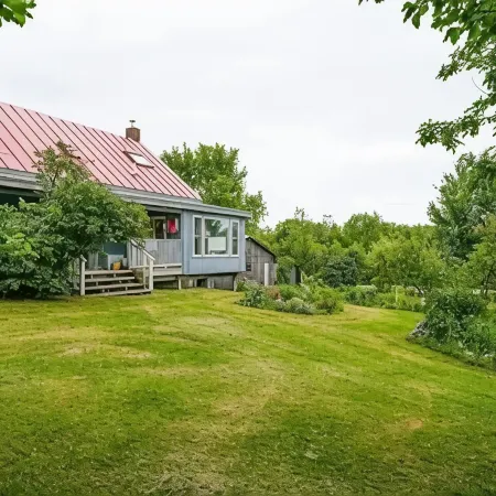 Hill top home located on 30 acres with privacy and surrounding natural beauty.