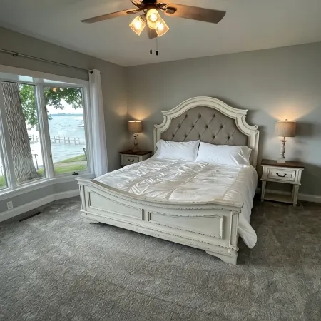 Enjoy this beach front lake home that boasts 66' of frontage with many amenities