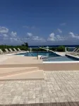 The Harvey Nicole: Modern Caribbean Ocean Front Condo Grand Cayman. - piscina