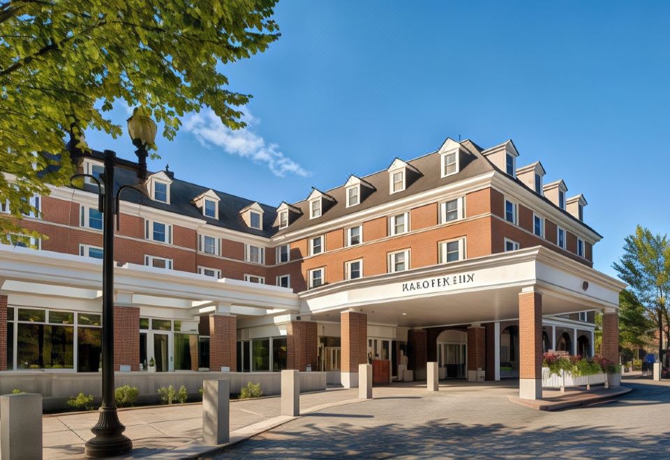 "a large brick building with a white canopy and the words "" hotel windsor inn "" on it" at Hanover Inn Dartmouth
