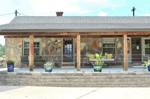 The Stone Schoolhouse - Gated Lakefront Acreage with views and historic charm