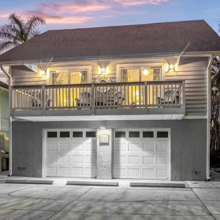 Perfect location Walk to the village and beach Private Balcony Heated Pool
