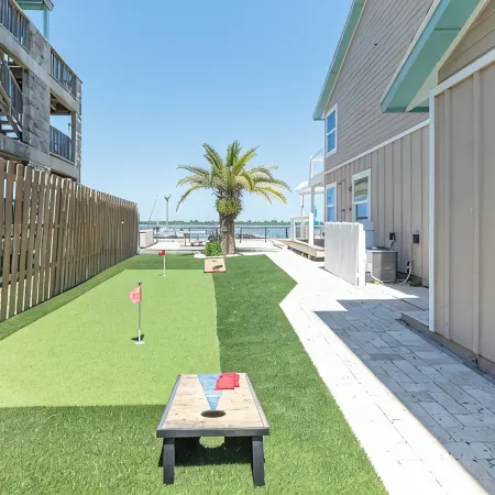 Waterfront home with dock, heated pool, & spectacular views- walk/bike downtown!