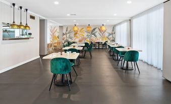 a dining room with tables and chairs arranged for a group of people to enjoy a meal together at Corrigans Cove