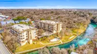 Updated Single Story Comal River Condo with Pool-Walk to Downtown NB