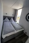 Houseboat Luv in Sonwik harbor with a view of Denmark
