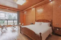Qiannan Bamboo Sea Colorful sunshine Southeast Holiday Homestay - Quầy Bar