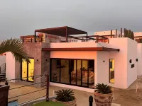 Modern, Clean & Airy Beach Retreat with Pool and Rooftop Ocean Views Hotels in El Sargento