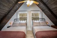Modern Riverfront A-Frame Cabin w/ Hot Tub, Fire Pit, Kayaks, Canoe, & Arcade