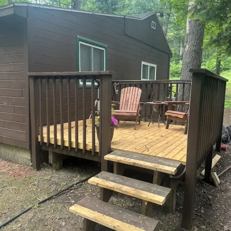 A Stream  runs through it. Comfy little cabin with a stream by your bedroom.
