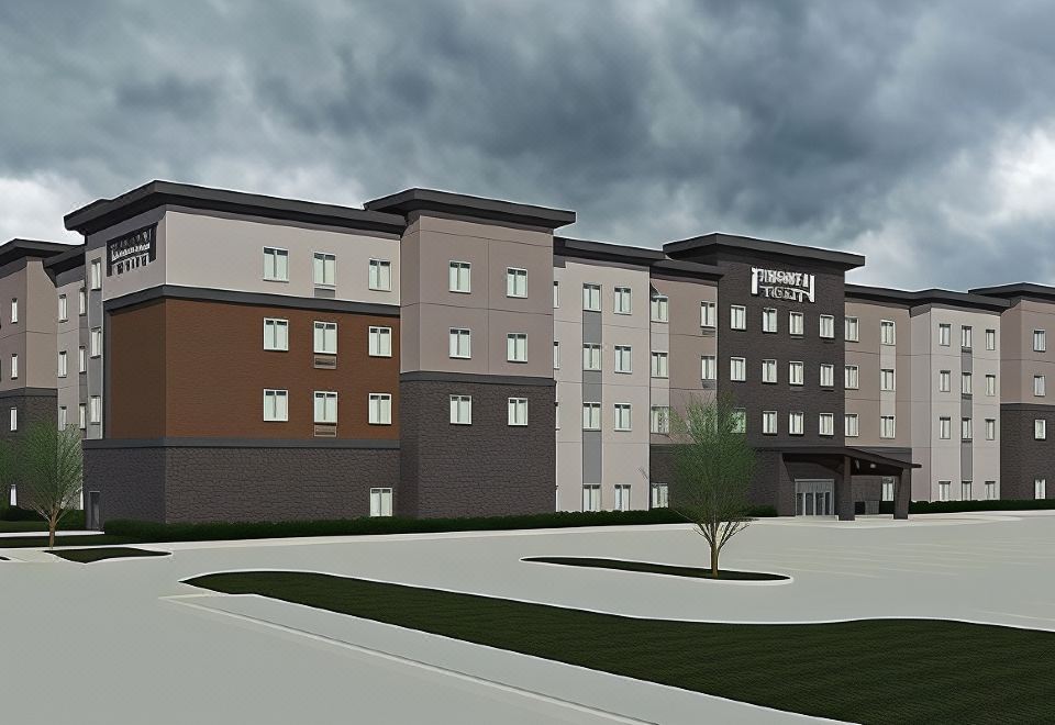 "a large , multi - story building with a gray facade and the words "" comfort suites "" on it" at Staybridge Suites Denver North - Thornton