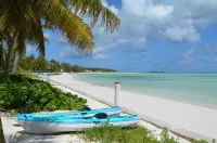 Beachfront one bedroom studio with full kitchen, covered porch and open deck.