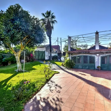 House with Garden Near the Sea