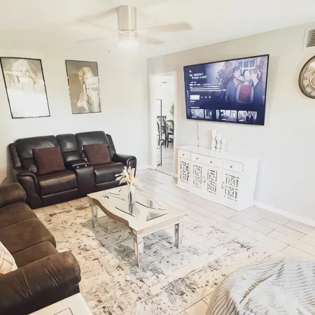 Beautiful Home in quiet neighborhood with a pool and close to stores & highways.