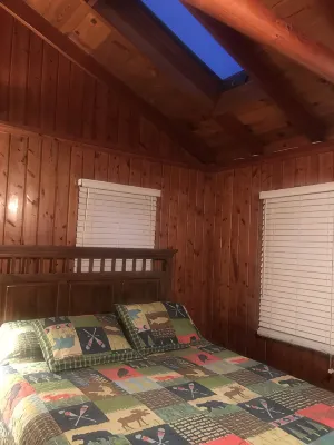 Indian Lakes Cabin with private beach and dock lake side