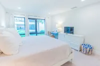 Breezy Beachside Property: Beach Views, Heated Pool, Pickleball & Kid Friendly! - balcony
