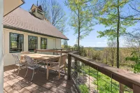 Unique and secluded A frame home on 31 acres with hot tub.