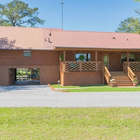 BEAUTIFUL WATERFRONT .  GNAT SCREENED BOATHOUSE AND AJOINING COVERED BOAT SLIPS