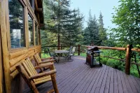 Unique Alaskan log home in trees & wild flowers on 14-acre private homestead.
