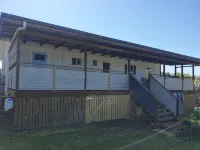 Indoor/outdoor pet-friendly beach house next to world-class beach and river.